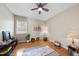 Bedroom space with natural light, hardwood floors, a yoga mat, and a cozy atmosphere for exercise at 6 Kersey Ct, Durham, NC 27713