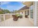 A spacious, neutral-toned deck features an outdoor sofa and chairs perfect for lounging at 6 Kersey Ct, Durham, NC 27713