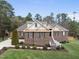 Charming brick home with a manicured lawn, tasteful landscaping, and a welcoming front porch at 6 Kersey Ct, Durham, NC 27713