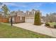 A brick and siding home features a two car garage and a well manicured front lawn at 6 Kersey Ct, Durham, NC 27713