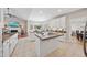 Open concept kitchen with granite counters, white cabinets, and breakfast bar seating at 6 Kersey Ct, Durham, NC 27713
