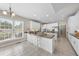 Large kitchen with white cabinetry, center island, and stainless steel appliances at 6 Kersey Ct, Durham, NC 27713