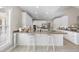 Spacious white kitchen featuring a large island with seating and stainless steel appliances at 6 Kersey Ct, Durham, NC 27713