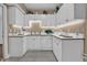 Well-maintained kitchen with bright cabinets, modern appliances, ample counter space, and natural lighting at 6 Kersey Ct, Durham, NC 27713