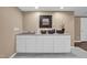Functional laundry room featuring ample counter space, storage cabinets, sink, and hard surface flooring at 6 Kersey Ct, Durham, NC 27713