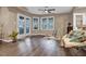 Bright living room with hardwood floors, natural lighting, seating area, and outside access at 6 Kersey Ct, Durham, NC 27713