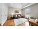 Bright living room featuring tray ceiling, hardwood floors, and plush seating at 6 Kersey Ct, Durham, NC 27713