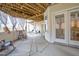 Covered patio with string lights, wood plank ceiling, and a stone floor, great for outdoor relaxation at 6 Kersey Ct, Durham, NC 27713