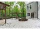 Backyard patio with multiple covered structures, hardscaped area and hot tub at 7116 Asheway Dr, Holly Springs, NC 27540