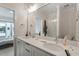 Bathroom featuring double sinks, white countertops and large mirror at 712 E Edenton St # 102, Raleigh, NC 27601