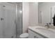 Bathroom featuring a walk-in shower, tile floors and updated sink at 712 E Edenton St # 102, Raleigh, NC 27601