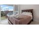 Bedroom featuring a comfortable bed and scenic views from a large window at 712 E Edenton St # 102, Raleigh, NC 27601