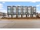 Modern townhomes feature sleek lines, large windows, and neutral color palette, with professionally landscaped front yards at 712 E Edenton St # 102, Raleigh, NC 27601