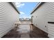 A rooftop deck has wooden-tile floor and table at 712 E Edenton St # 102, Raleigh, NC 27601