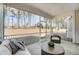 Screened-in patio featuring comfortable seating and views of the lush backyard at 7128 Trappers Ct, Zebulon, NC 27597