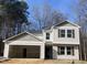 Charming two-story home with an attached two car garage and wood-look shutters at 796 S Old Carriage Rd, Rocky Mount, NC 27804