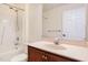Bathroom featuring a shower-tub combo with a large vanity and mirror at 9510 Dellbrook Ct, Raleigh, NC 27617