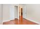 Spacious bedroom featuring hardwood floors, a closet and natural light at 9510 Dellbrook Ct, Raleigh, NC 27617