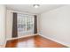 Bright bedroom with hardwood floors, neutral walls, and natural light at 9510 Dellbrook Ct, Raleigh, NC 27617