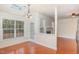 Bright breakfast nook featuring skylights, large windows, and hardwood floors at 9510 Dellbrook Ct, Raleigh, NC 27617