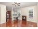 Open living room features hardwood floors, fireplace and seamless access to the kitchen at 9510 Dellbrook Ct, Raleigh, NC 27617