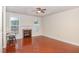 Spacious room featuring hardwood floors, a fireplace, and neutral paint at 9510 Dellbrook Ct, Raleigh, NC 27617