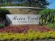 Stone sign welcomes you to Brier Creek Country Club, framed by lush landscaping at 9510 Dellbrook Ct, Raleigh, NC 27617