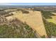 Large expanse of property featuring open pasture land and lightly wooded acreage at 9550 Silk Hope Liberty Rd, Siler City, NC 27344