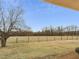 Expansive backyard with a serene view of a grassy field at 9550 Silk Hope Liberty Rd, Siler City, NC 27344