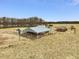 Aerial view of a farm with a barn, hay storage and a single-Gathering home on a large lot at 9550 Silk Hope Liberty Rd, Siler City, NC 27344