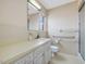 Bright bathroom featuring tiled walls, a neutral color palette, and a convenient walk-in shower at 9550 Silk Hope Liberty Rd, Siler City, NC 27344