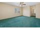 Bedroom with green carpet, ceiling fan, and view to outside at 9550 Silk Hope Liberty Rd, Siler City, NC 27344