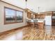 Light-filled dining room features wood floors and windows offering exterior views at 9550 Silk Hope Liberty Rd, Siler City, NC 27344