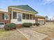 Charming front porch with ample space and attractive landscaping at 9550 Silk Hope Liberty Rd, Siler City, NC 27344