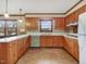 Bright kitchen features wood cabinets, an eat-in area and vintage appliances at 9550 Silk Hope Liberty Rd, Siler City, NC 27344