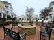 Outdoor community space featuring fire pit, benches, and grills at 10420 Sablewood Drive Dr # 102, Raleigh, NC 27617