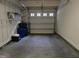 A two car garage featuring shelving at 10420 Sablewood Drive Dr # 102, Raleigh, NC 27617