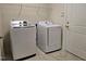 Laundry room featuring a modern white washer and dryer at 10420 Sablewood Drive Dr # 102, Raleigh, NC 27617
