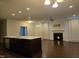 Living room with fireplace, kitchen island, and open floor plan at 10420 Sablewood Drive Dr # 102, Raleigh, NC 27617