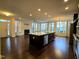 Spacious living area with hardwood floors, a fireplace, stainless steel appliances, and lots of sunlight at 10420 Sablewood Drive Dr # 102, Raleigh, NC 27617