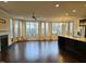 Bright living room featuring hardwood floors, many windows, and a kitchen island at 10420 Sablewood Drive Dr # 102, Raleigh, NC 27617