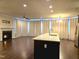 Spacious living room with a fireplace and an island at 10420 Sablewood Drive Dr # 102, Raleigh, NC 27617