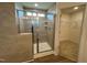 Bathroom featuring a glass enclosed shower with stone walls and walk-in closet at 116 Willow Cameron Way, Angier, NC 27501