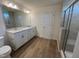 Bathroom features a double sink vanity and a glass enclosed shower at 116 Willow Cameron Way, Angier, NC 27501