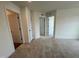 Bright bedroom with neutral carpet, white trim, and doors, offering a blank canvas for customization at 116 Willow Cameron Way, Angier, NC 27501