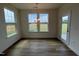 Inviting dining area with large windows and a stylish chandelier, perfect for Gathering meals at 116 Willow Cameron Way, Angier, NC 27501