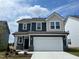 Charming two-story home with a two-car garage, craftsman details, and manicured landscaping at 116 Willow Cameron Way, Angier, NC 27501