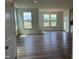 Spacious living room with abundant natural light and modern flooring at 116 Willow Cameron Way, Angier, NC 27501