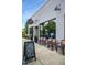 Vicious Fishes Brewery storefront with sidewalk pick-up parking, chairs and a chalkboard sign at 116 Willow Cameron Way, Angier, NC 27501