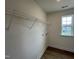 Walk-in closet features custom shelving and a window with a view at 116 Willow Cameron Way, Angier, NC 27501